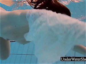 mind-blowing sandy-haired in the milky sundress underwater